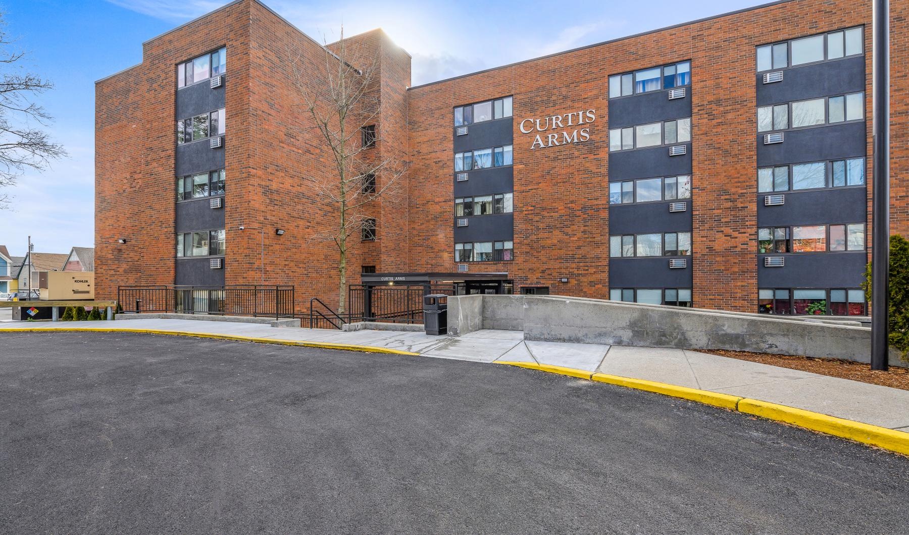 a building with a road in front